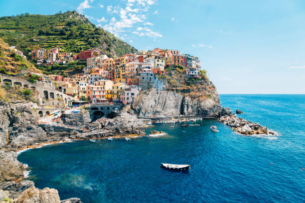 Seaside village Manarola, Colorful buildings and beach in Cinque Terre, Italy stock photo