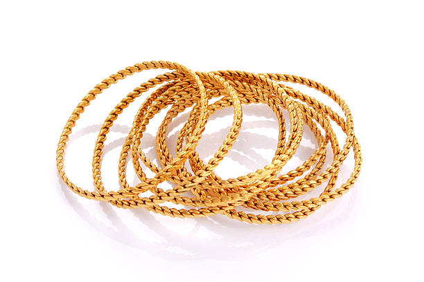 istock Gold bracelets isolated on white 97642031