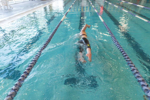 istock Adaptive athlete swims laps in a pool 976426336