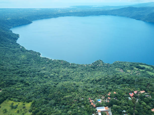 Lagoon Apoyo in Nicaragua Lagoon Apoyo in Nicaragua aerial drone view masaya volcano stock pictures, royalty-free photos & images