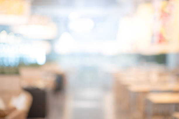 istock Abstract blurred restaurant background. Blurry cafe or coffee shop with dining tables, chairs and other decorations. Blur backdrop for design element. Food and beverage concept. 976446562
