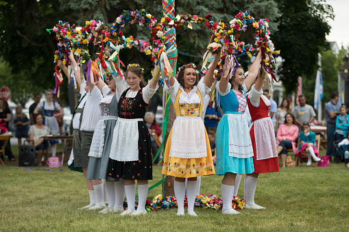 Frankenmuth, Michigan, USA - June 10, 2018 Members from the Frankenmuth dance center perform the maypole dance during the Bavarian Festival.