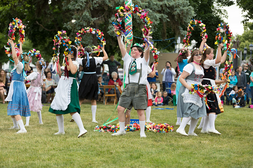 Frankenmuth, Michigan, USA - June 10, 2018 Members from the Frankenmuth dance center perform the maypole dance during the Bavarian Festival.