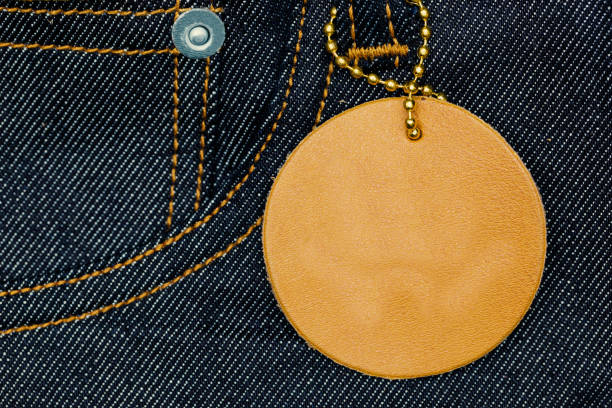 Plank leather label on blue jean denim with copy space.