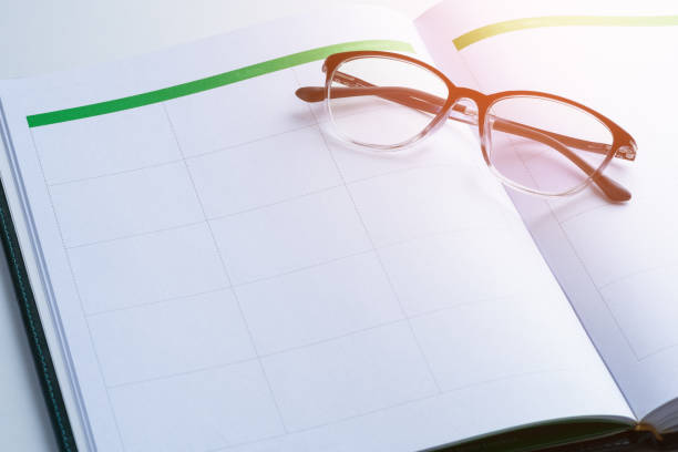 istock business reminder concept with Appointment book, glasses 976460094
