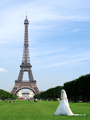 Paris, France - March 19, 2023: The Flame of Liberty, a gold leaf covered replica of the flame from the Statue of Liberty and the Eiffel Tower at the background in Paris, France.