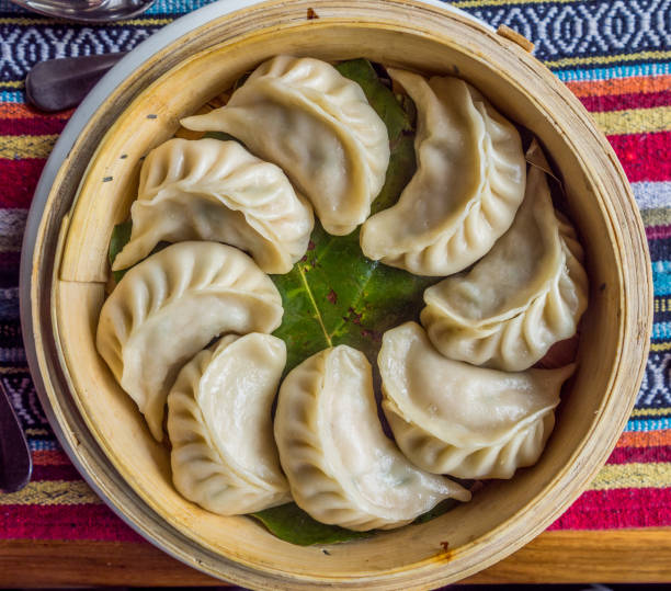 Momo: nepalese dumplings Momo: the traditional dish of Nepal kitchen chinese dumpling stock pictures, royalty-free photos & images
