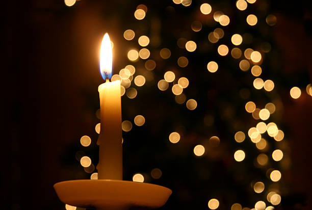 Candle light and a Christmas tree christmas candle. christmas decore candle stock pictures, royalty-free photos & images
