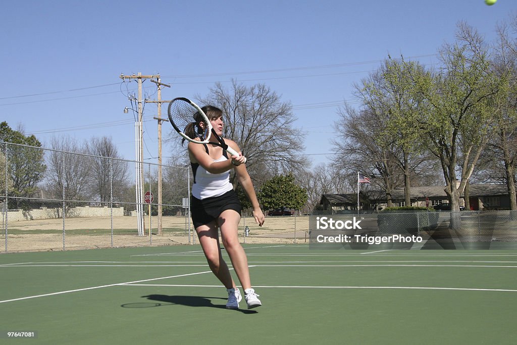 aggressive tennis woman heading towards the net. Olympic Mountains - Washington State Stock Photo