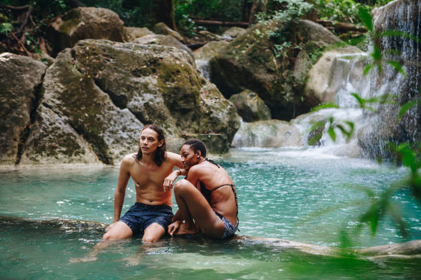 istock Couple enjoying the waterfall 976474518