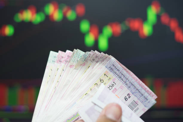 Close up Thai lottery tickets with business background