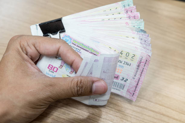 istock Close up Thai lottery tickets with business background 976480054