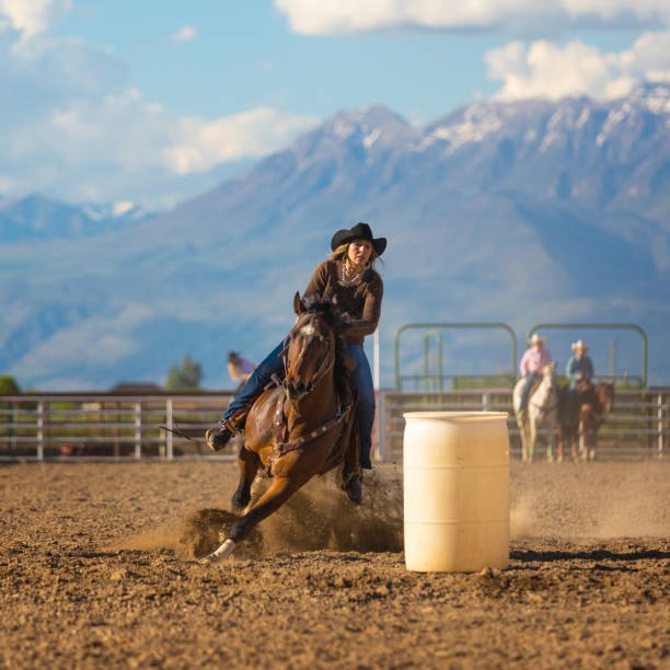 istock Cowgirl barrel racing rodeo 976480102