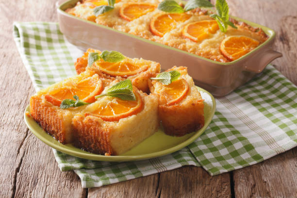 istock Delicious orange pie syrup soaked close-up. horizontal 976480118