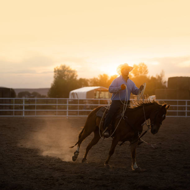 istock Cowboy practicing moves with lasso rope 976480356