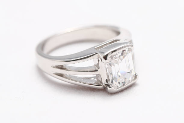 istock Beautiful diamond ring on white fabric 976497370