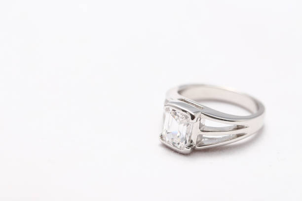 istock Beautiful diamond ring on white fabric 976497374