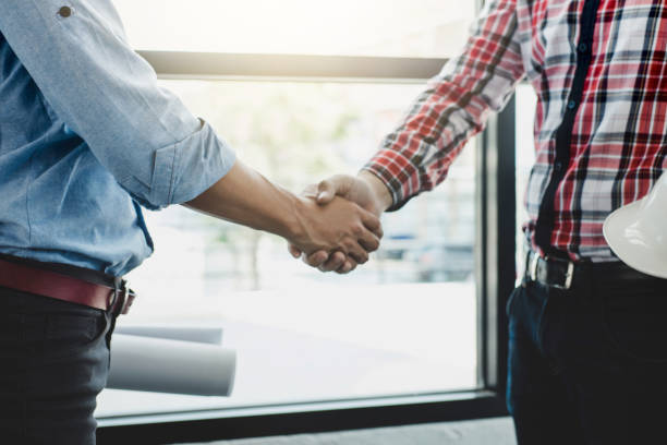 istock Meeting and greeting, Two engineer or architect meeting for project, handshake after consultation and conference new project plan, contract for both companies, success, partnership 976497438