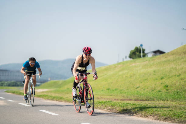 istock Two senior men riding their racing bicycles 976497676