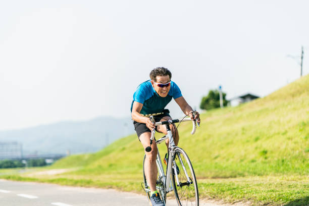 istock Two senior men riding their racing bicycles 976497944