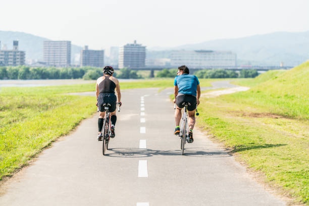 istock Two senior men riding their racing bicycles 976497954