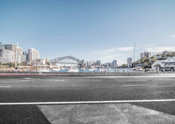 istock empty waterfront road with Sydney Harbor Bridge on background 976510156