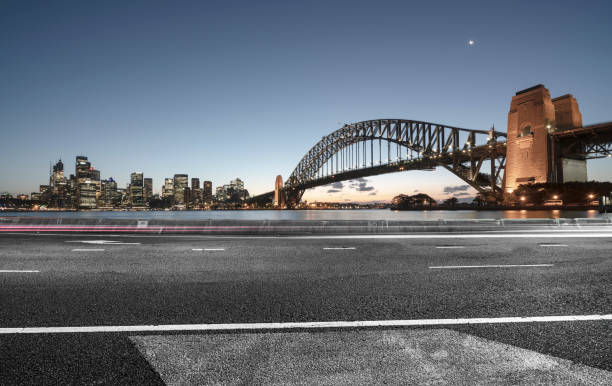 istock urban road by Sydney Harbor Bridge 976510348