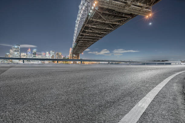 istock empty highway travel under Sydney Harbor Bridge,Australia 976510460