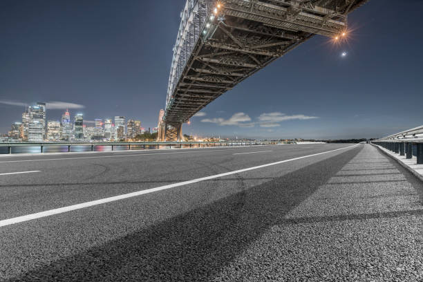 istock empty highway travel under Sydney Harbor Bridge,Australia 976512400