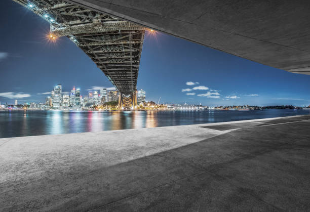 istock empty car park with sydney harbor bridge on background 976512632