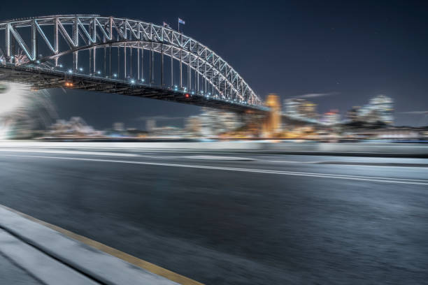 istock blurred motion road by Sydney Harbor Bridge on background 976512958