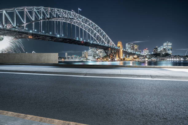 istock empty highway travel under Sydney Harbor Bridge,Australia 976513100