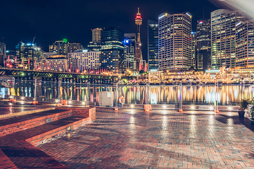 Seaside Promenade and Sydney skyline at night at the Circular Quay in Australia.
