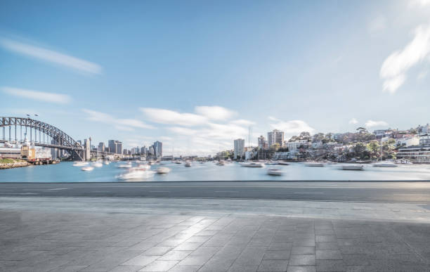 istock empty road with sydney harbor bridge on background 976524838