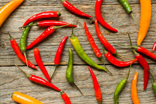 istock Chili pepper hot mix on wooden rustic background 976528980
