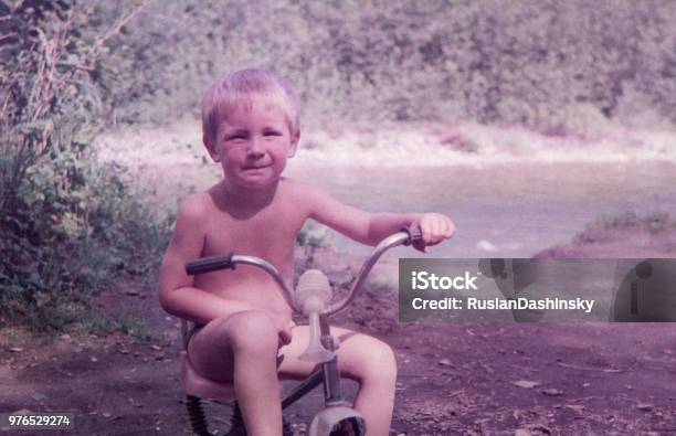 Kid Riding On A Threewheeled Bicycle Stock Photo - Download Image Now - 1990-1999, Child, Former Soviet Union