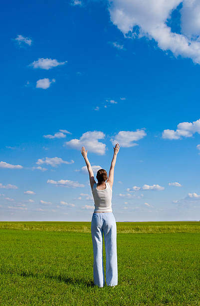istock woman rising up hands 97652952