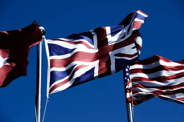 istock Union Jack  &  American Flag  in the Wind 976531866