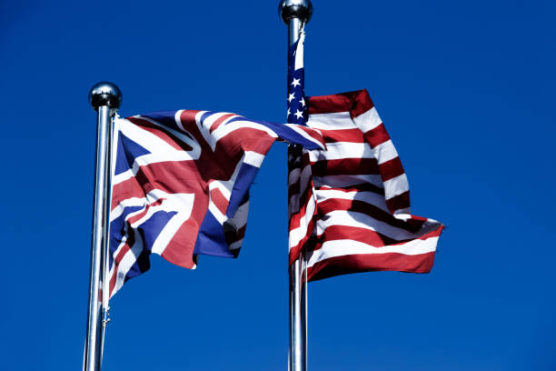 istock Union Jack  &  American Flag  in the Wind 976531976