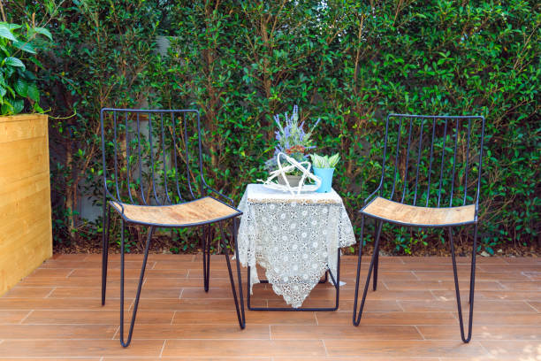 istock Black metal table set in the garden with decoration. 976532034