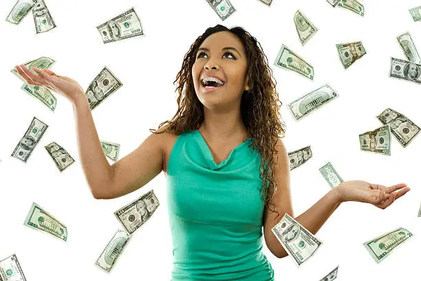 Photo of A woman experiencing the sky raining money