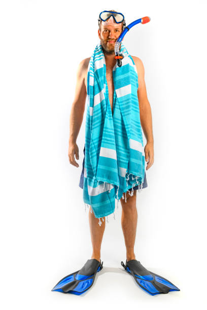 istock Man ready for summer vacation with diving gear on a white background 976534986