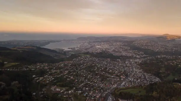 Photo of Aerial view of Dunedin city at sunrise from the sky