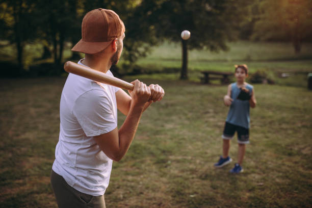 istock Father and his son playing baseball 976540112