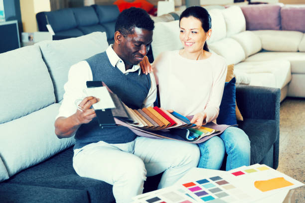 istock Couple choosing materials for furniture 976554900