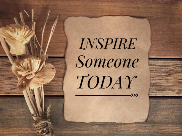 Motivational and inspirational quote. ‘Inspire someone today’ written on a piece of paper. With vintage styled background. spirit guides stock pictures, royalty-free photos & images