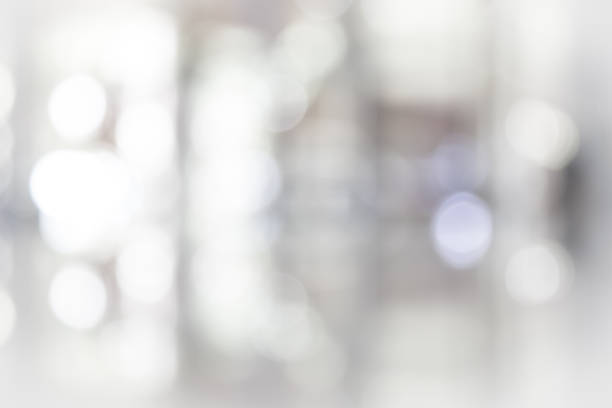 istock white blurred of department store background. Defocused blur background. 976555276