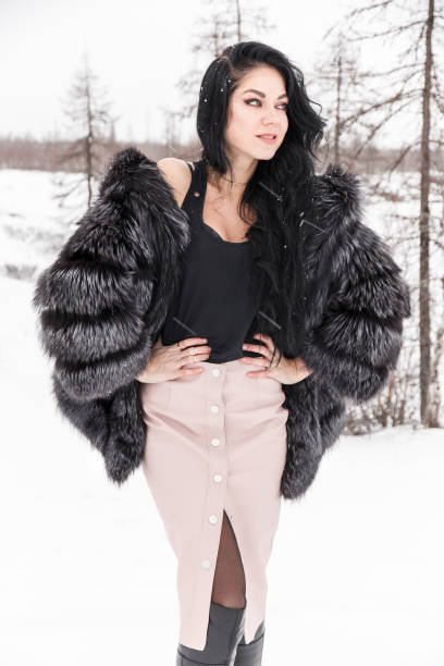 istock Woman in a winter forest 976558148