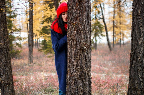 Pretty young woman walking in the forest