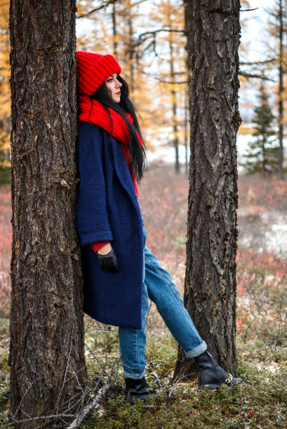 istock Pretty young woman walking in the forest 976560254